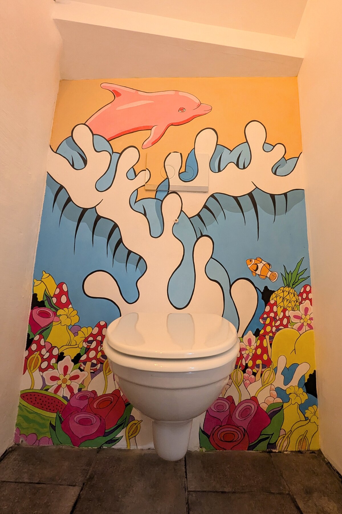 The hand-painted bathroom mural